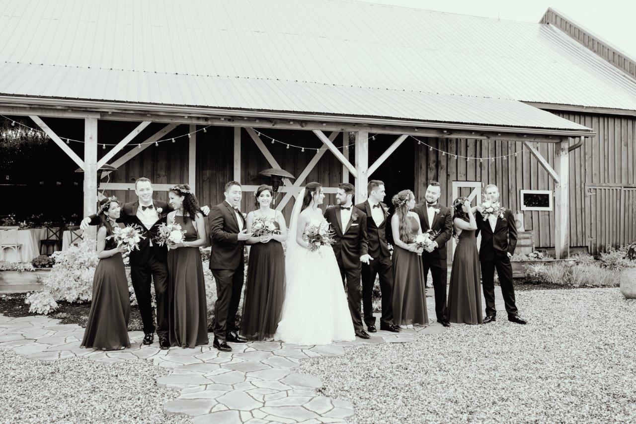 evermore weddings wedding party in front of barn