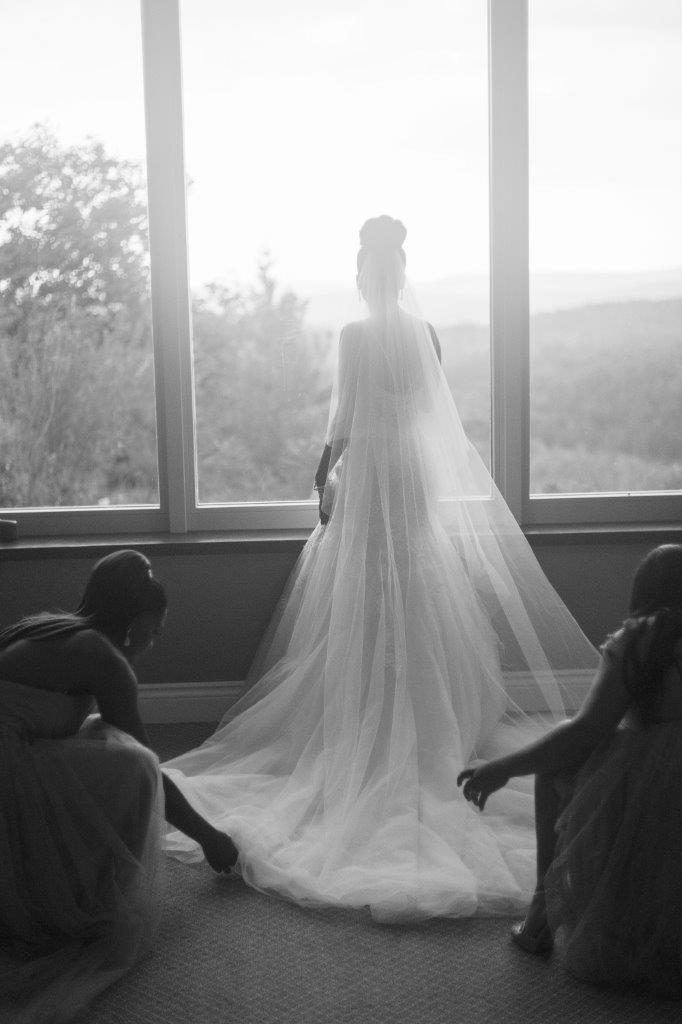 kathi robertson wedding le belvedere bride looking out window landscape